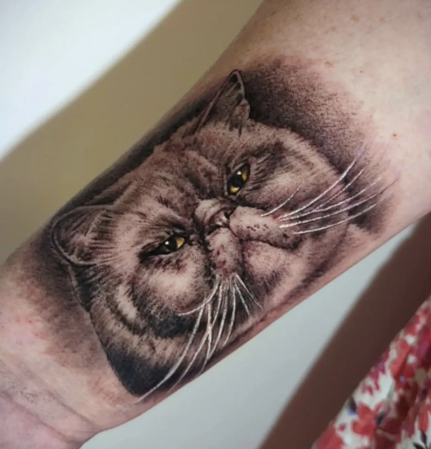 Realistic bat portrait tattoo with intricate wing detail and gothic elements